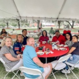 Team members gather for a picnic on Team Appreciation Day.