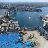 168 concrete pours over 2.5 years - the team finishes their final pour topping out the building.