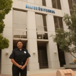 Allied Universal Security Professional in Front of Allied Universal Building