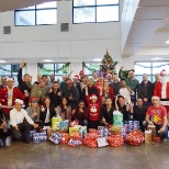 Our IT team celebrating the holidays and giving back to the community through Adopt-a-family!