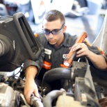 Inspecting a heavy duty diesel engine; our technicians work on a wide range of equipment.