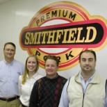 the picture is of some people that work at a Smithfeild Packing Company